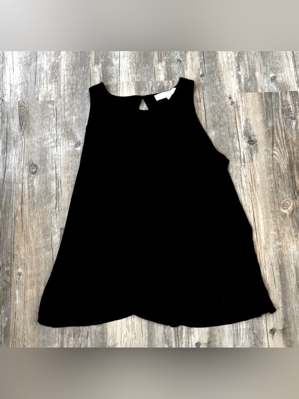 Loft black sleeveless flowy tank top featuring a keyhole back opening